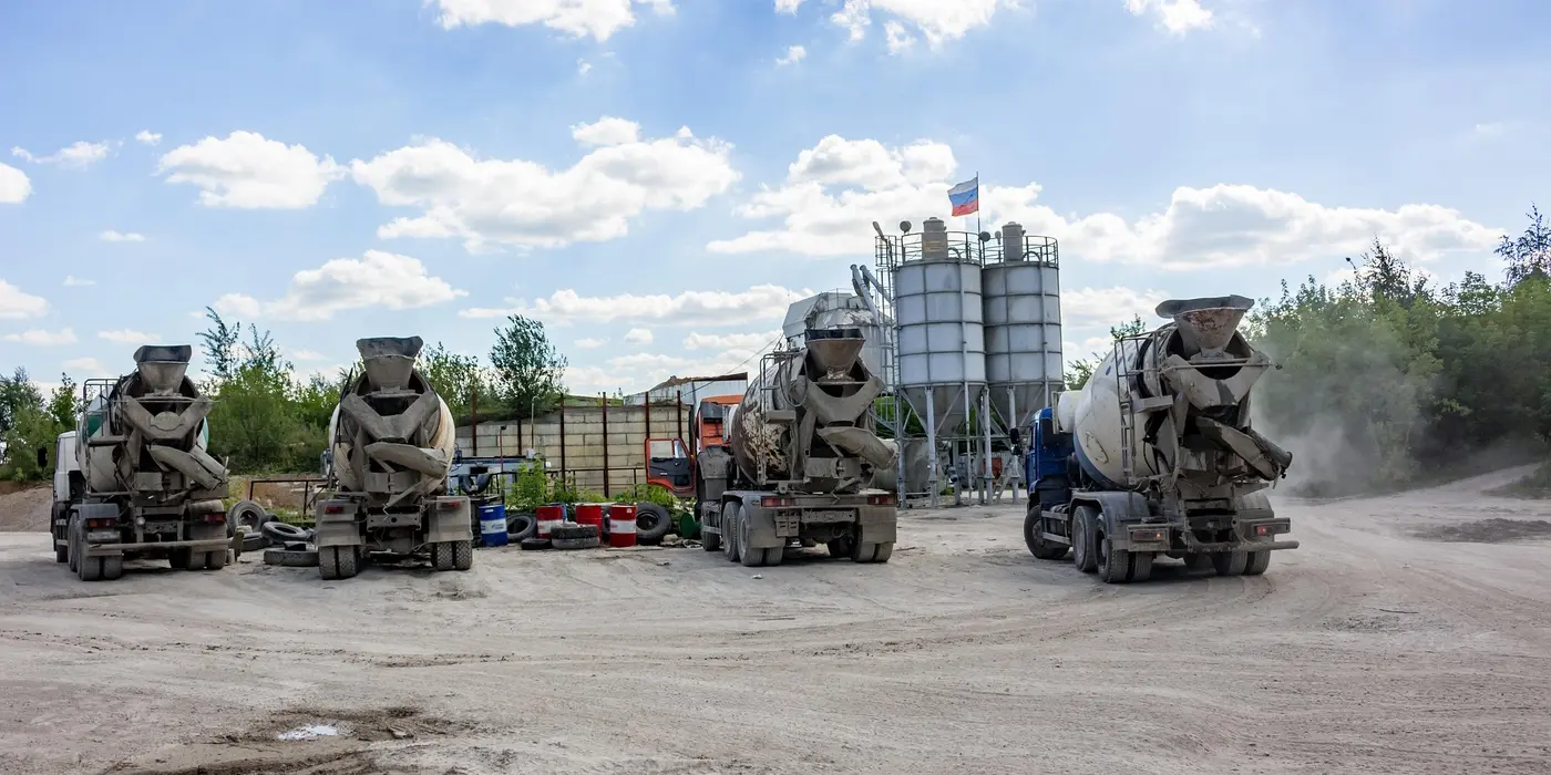 a concrete plant with 4 cement trucks parked from Leander Stamped Concrete in Leander, TX - concrete patios