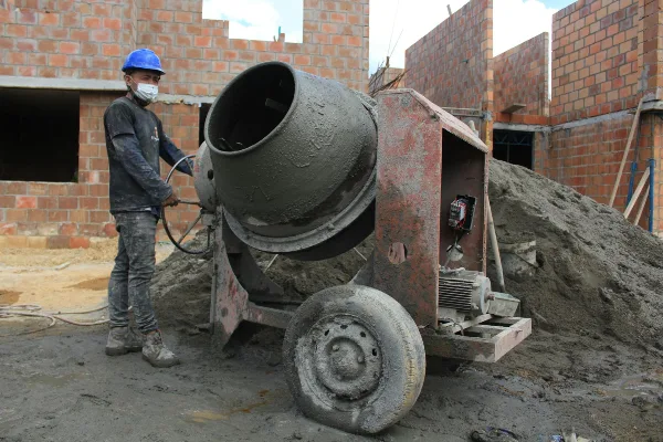 a concrete worker using a cement mixer from Leander Stamped Concrete in Leander, TX - concrete patios