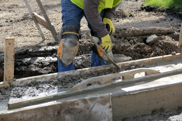 a concrete worker working on a concrete footing from Leander Stamped Concrete in Leander, TX - concrete patios
