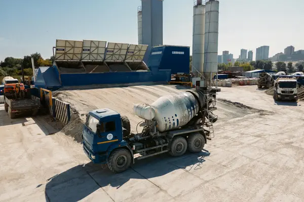 a cement plant with some cement trucks in it from Leander Stamped Concrete in Leander, TX - concrete patios