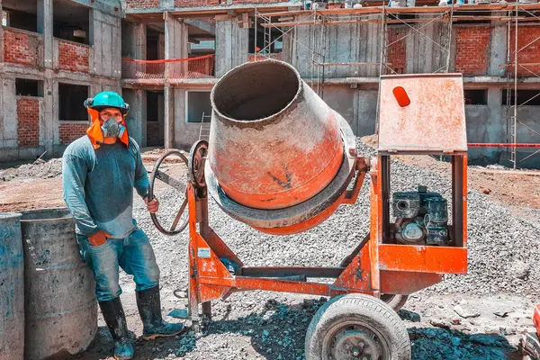 a concrete worker next to a cement mixer from Leander Stamped Concrete in Round Rock, TX - Round Rock TX